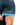 Waggle Logo on the left sleeve of the Abominable Pique Polo on a male model in front of a white background