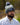 Model wearing the Bird Dog SZN Pom Beanie on the golf course with greenery in the background