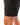 Close up on the Waggle "W" on the left leg of the Charcoal Daydrift Shorts on a male model in front of a white background