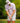 Male model wearing the Clawdad Men's Polo on the golf course, with green trees in the background