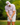 Male model wearing the Clawdad Men's Polo on the golf course, with green trees in the background