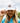 A female model wearing the Coco Loco Flight Hat outside with clouds and greenery in the background