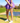 Model wearing the Flairway skort on the golf course with greenery in the background