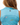 Waggle "W" logo on the back of the Dog Park Sleeveless Polo on a model in front of a white background