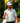 Male Model wearing the Husker Polo on the golf course with greenery in the background