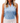 Front of Lily Pond Sleeveless Polo on Model in front of grey background