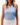 Front of Lily Pond Sleeveless Polo on Model in front of grey background
