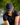 Model wearing the Loon Lake 2.0 Flight Hat on the Golf course with greenery in the background