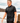 Male Model wearing the Loon Lake 2.0 Pique Polo walking along a river