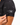 Close up on the waggle patch on the left sleeve of the Loon Lake 2.0 Pique Polo on a model in front of a white background
