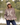 Female model wearing Wildknit Crewneck Sweater while standing by a pond.