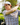 Male model wearing the Old Fashioned Polo on the golf course with greenery in the background