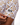 Waggle Logo on the left sleeve of the Old Fashioned Polo on a male model in front of a white background