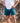 Model wearing the Daydrift shorts outside with rocks in the background