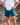 Model wearing the Daydrift shorts outside with rocks in the background