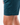Close up on the Waggle "W" on the left leg of the Pacific Daydrift Shorts on a male model in front of a white background