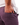 Close up on the back right pocket of the Purple Ash Daydrift Shorts on a male model in front of a white background