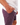 Close up on the right pocket of the Purple Ash Daydrift Shorts on a male model in front of a white background