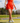 Model wearing the Flairway skort on the golf course with greenery in the background