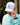 Model wearing the Shred with Sass Rope Hat outside with greenery and a building in the background