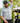 Male Model wearing the Tacklebox Polo on the golf course with greenery in the background