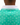 Waggle "W" logo on the back of the Tortuga Pique Polo on a male model in front of a white background