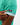 Waggle patch on the left sleeve of the Tortuga Pique Polo on a male model in front of a white background