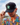 Model wearing the Tortuga Hat doing a hat tilt with blue sky as the background