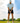 Male Model wearing the Toy Golfers Polo on the golf course with blue sky and clouds in the background