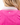Waggle "W" Logo on the back of the Wine Down Pique Polo on a model in front of a white background