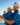 Man on golf course in hat, polo and shorts