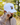 Male model wearing the 19th Hole Hat outside with greenery in the background