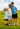Three children standing together outside, wearing t-shirts and snapbacks.