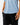 Close up on the curved Hem on the Albatross Hybrid Polo on a model in front of a light gray background.