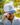 Model wearing the Alpha Corduroy Hat outside with greenery in the background