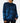 Front of the Alpha Wildknit Sweater on a Female Model in front of a light gray background.