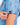 Close up on the Waggle W sleeve logo on the April Showers Polo on a model in front of a light gray background.