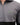 Gray jacket with a green patch on a white background