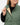 Close up on the Button Closure on the Balsam Crosscut Vest on a model in front of a light gray background