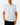 Untucked Front of the Beached It Polo on a model in front of a light gray background.