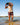 Model wearing the Bear Path Shoreline short walking out of a lake.