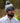 Model wearing the Bird Dog SZN Pom Beanie on the golf course with greenery in the background