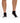 Black Pair of Wavelength Socks on a model in front of a white background