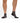 Gray Pair of Wavelength Socks on a model in front of a white background