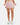 Model showing the Flair of the skort in front of a light gray background