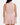 Back of the Blush Matchplay Mock Neck on a model in front of a light gray background.