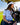 Model wearing the Boat Day Hybrid Polo riding in a golf cart on the golf course.