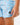 Close up on the Waggle W patch on the left leg of the Bobby Shoreline Short on a model in front of a light gray background.