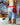 Model wearing the Bobby Shoreline Short climbing into a hot tub.