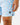 Close up on the Waggle W patch on the left leg of the Bobby Shoreline Short on a model in front of a light gray background.